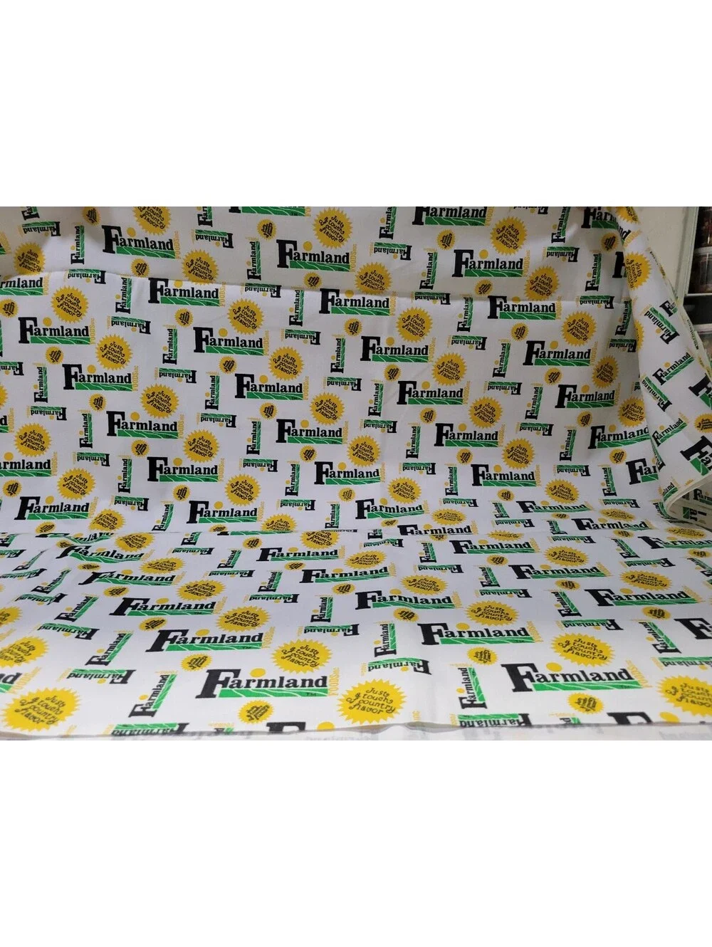 Farmland Cotton Fabric with Yellow and Green Logo Print 1 yard